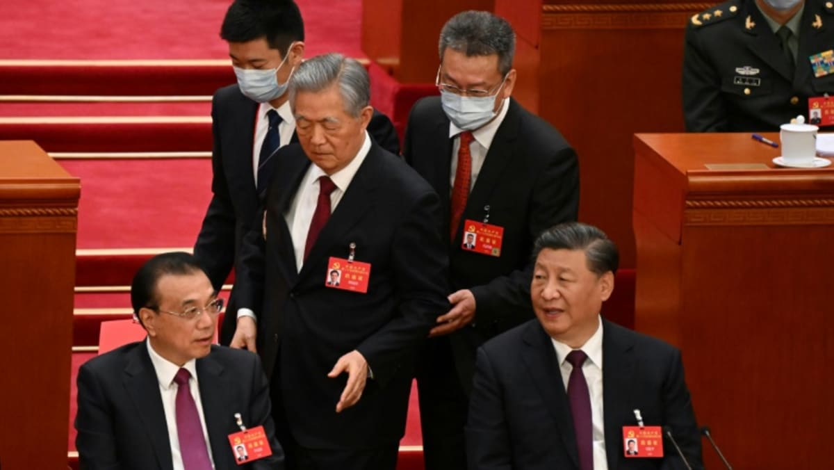 former-china-president-hu-jintao-escorted-out-of-congress-closing-ceremony