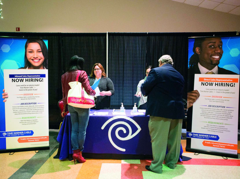 Job seekers at a career fair in Ohio. President Barack Obama’s economic advisers say the unemployment rate will average 6.9 per cent this year, declining to an average of 
6.4 per cent 
in the next. Photo: Bloomberg