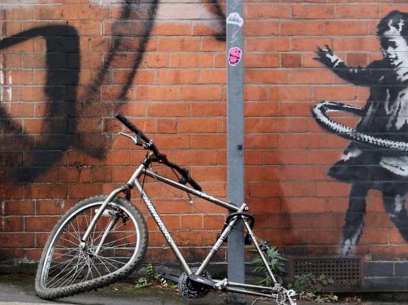 British artist Banksy claims hula-hooping girl street art British artist Banksy claims hula-hooping girl street art