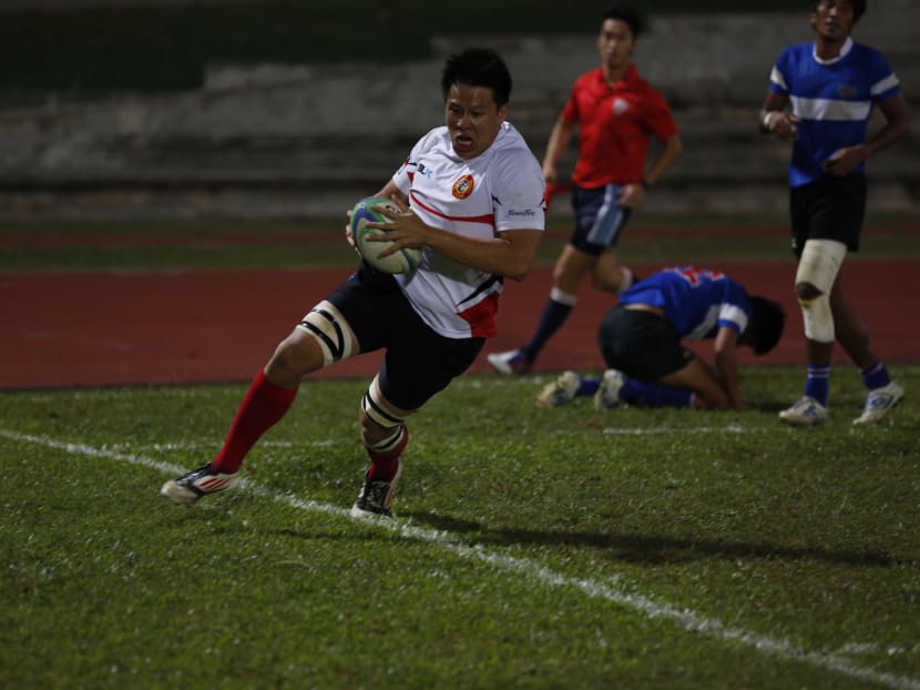 Singapore prop Reiner Leong fights through several Chinese Taipei players to score a try during Singapore’s 30-19 win over Chinese Taipei in the Asian Tri Nations tournament. Photo: Singapore Rugby Union