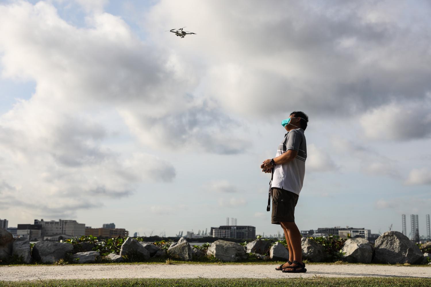 An enthusiast flying a drone at the unmanned aircraft flying area at Pandan Reservoir on July 17, 2022. An enthusiast flying a drone at the unmanned aircraft flying area at Pandan Reservoir on July 17, 2022.