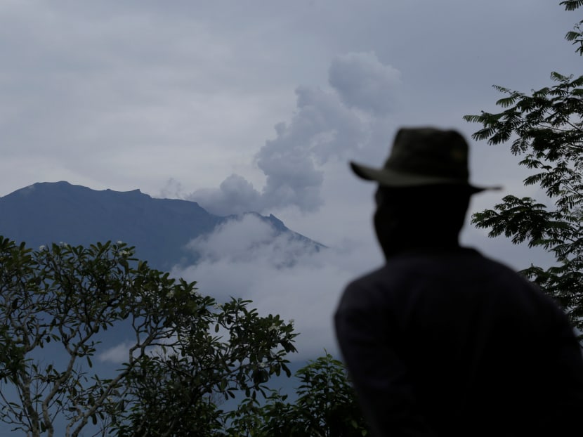 A villager looks at Mount Agung following a phreatic eruption in Rendang Village, Karangasem, Bali. Photo: Reuters