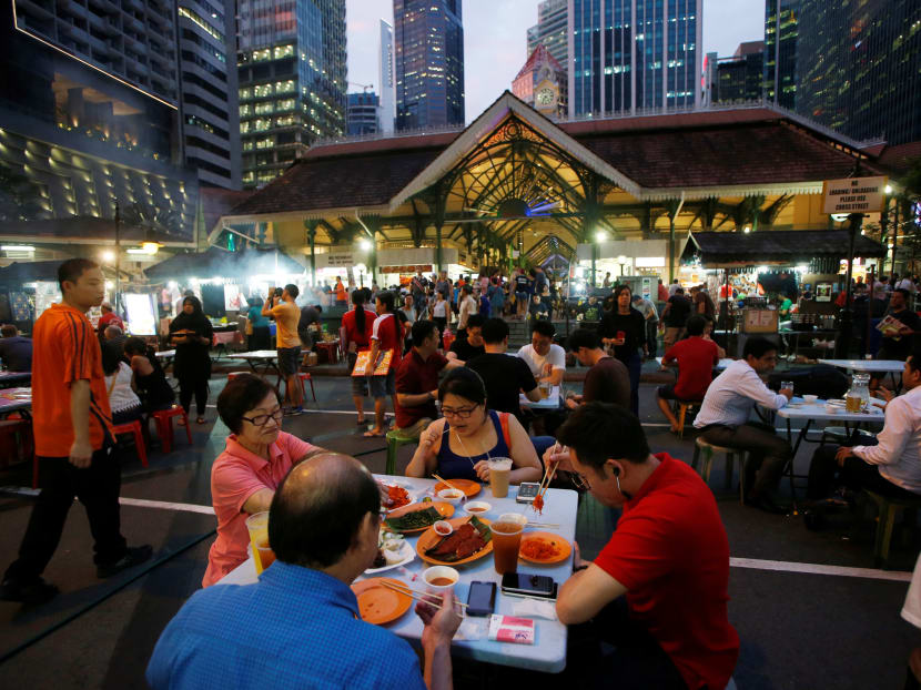 People eating at Lau Pa Sat food centre, Jul 29, 2016. Photo: Reuters