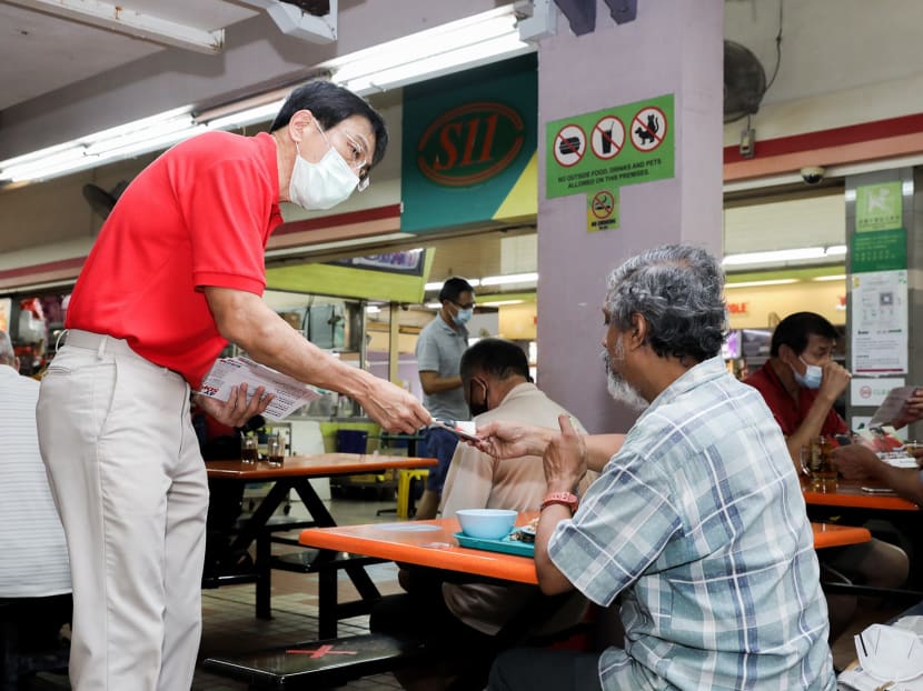 Dr Chee Soon Juan, secretary-general of the Singapore Democratic Party distributing flyers during a walkabout at Bukit Batok on Friday, June 26, 2020. Members of the public were reminded to continue observing safe distancing as political parties and candidates ramp up their campaigning activities in the lead-up to the General Election.