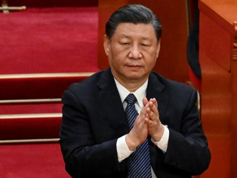 China's President Xi Jinping applauds during the fifth plenary session of the National People's Congress (NPC) at the Great Hall of the People in Beijing on March 12, 2023.