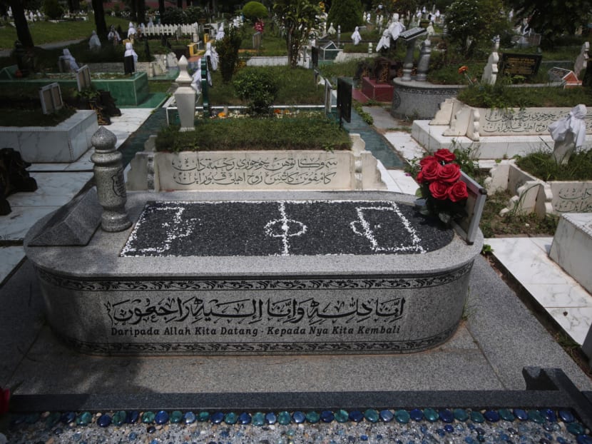 The grave of football icon Dollah Kassim will be affected by the expansion of Tengah Air Base. Photo: Jason Quah/TODAY