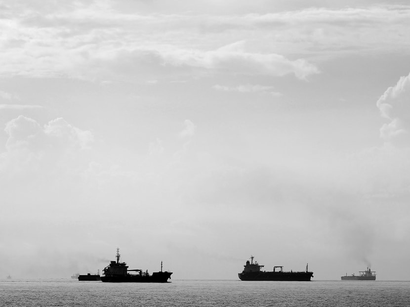 Tankers travel through the Singapore Strait July 6, 2014. Reuters file photo