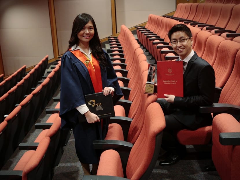 Ms Lau Yanling won the Southeast Asian Mathematical Society Book Prize and Mr Chiew Jing Wen received the Outstanding Youth in Education Award at the Teachers’ Investiture Ceremonies at Nanyang Technological University yesterday. Photo: Jason Quah