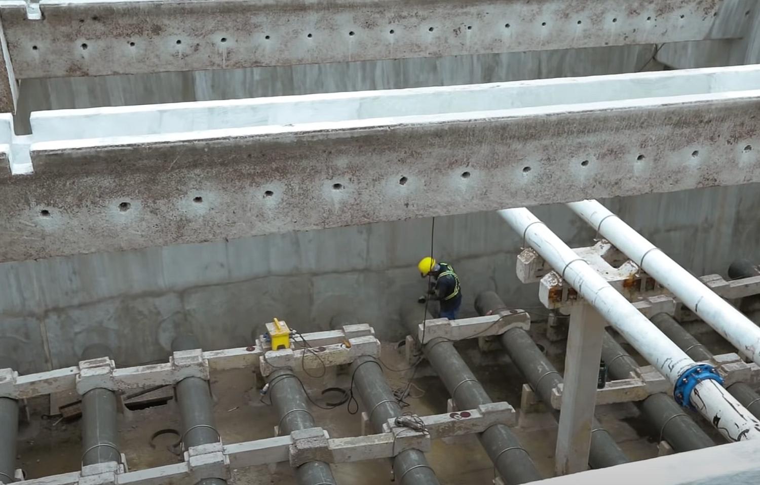 A man carrying out upgrading works at Choa Chu Kang Waterworks in 2019. A man carrying out upgrading works at Choa Chu Kang Waterworks in 2019.