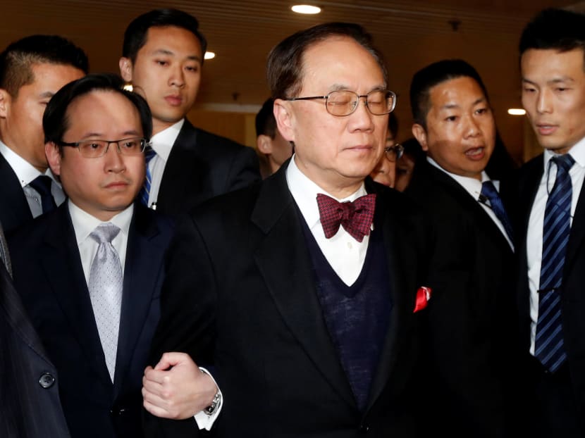 Former Hong Kong Chief Executive Donald Tsang (C), after being found guilty of misconduct, leaves the High Court on bail with his son Thomas (L) in Hong Kong, China February 17, 2017. Photo: Reuters