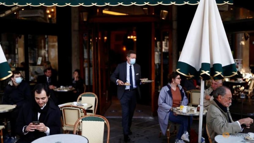Parisians tuck into coffee and croissants again as cafes re-open Parisians tuck into coffee and croissants again as cafes re-open