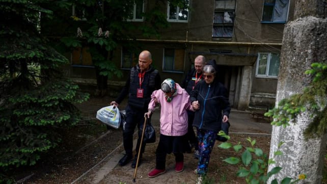Ukrainian rescuers evacuate elderly and infirm as Russians close in