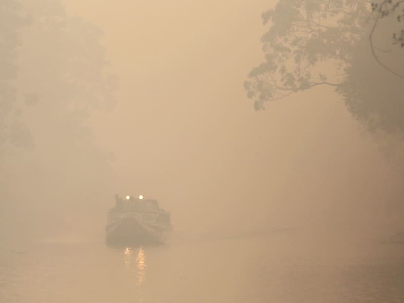 A wooden boat is seen on Air Sugihan river during haze shrouds in Ogan Komering Ilir, Indonesia's South Sumatra province, October 7, 2015. Photo: Antara Foto via Reuters A wooden boat is seen on Air Sugihan river during haze shrouds in Ogan Komering Ilir, Indonesia's South Sumatra province, October 7, 2015. Photo: Antara Foto via Reuters