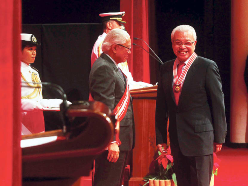 Mr Chua Thian Poh (right), who is chairman and CEO of Ho Bee Land, receiving the Distinguished Service Order from President Tony Tan  at the National Day Awards held at NUS yesterday. Photo: Ooi Boon Keong