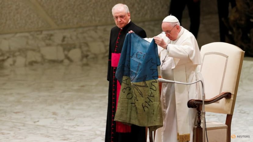 Pope, holding Ukrainian flag, condemns 'the massacre of Bucha' Pope, holding Ukrainian flag, condemns 'the massacre of Bucha'