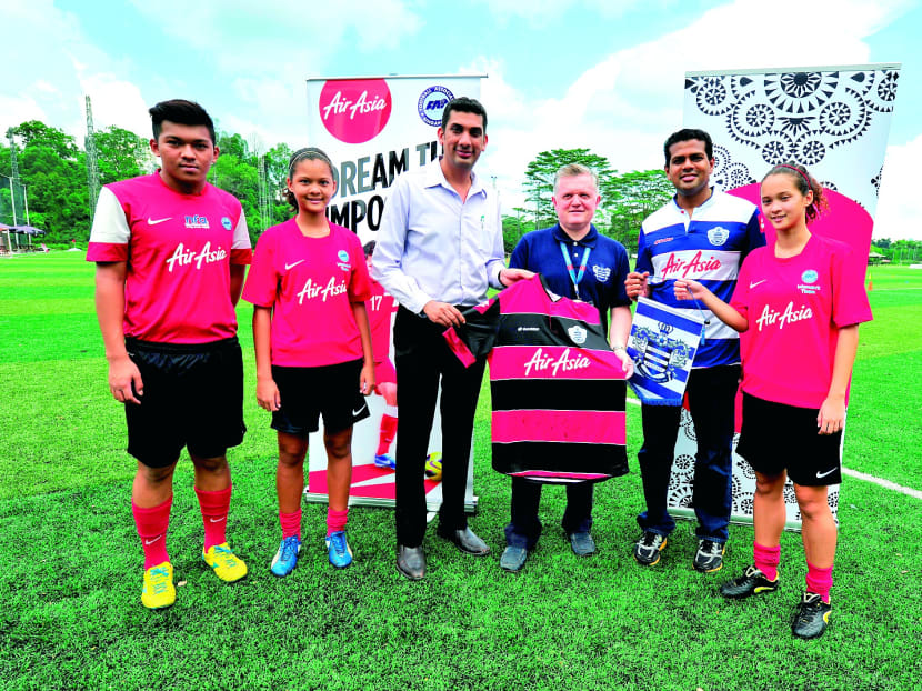 QPR in the Community Trust CEO Andy Evans (fourth from left) and  FAS Assistant Director (Commercial and Business Development) Rikram Jit Singh (third from left) at the Cage Sports Park for the Coaching Clinic Tour. Photo: AirAsia