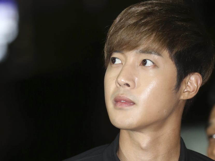 South Korean singer and actor Kim Hyun-joong arrives at the Gangnam police station in Seoul, South Korea, Sept 2, 2014.  Photo: AP