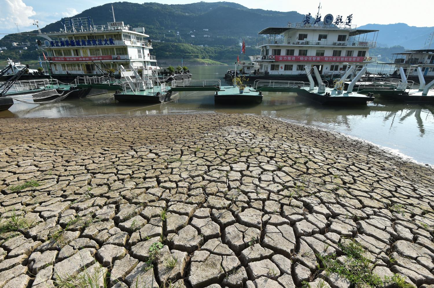 This photo taken on August 16, 2022 shows a section of a parched river bed along the Yangtze River in China's southwestern Chongqing. This photo taken on August 16, 2022 shows a section of a parched river bed along the Yangtze River in China's southwestern Chongqing.