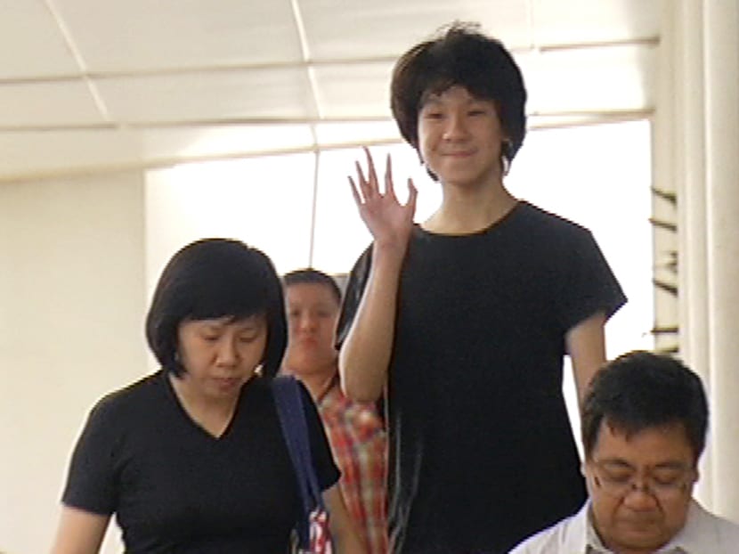 Amos Yee leaves the State Courts with his parents. Screengrab from Channel NewsAsia
