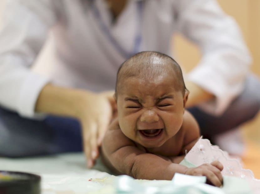 Pietro Rafael, who has microcephaly, reacts to stimulus during an evaluation session with a physiotherapist at the Altino Ventura rehabilitation center in Recife, Brazil, January 28, 2016. The baby was born with microcephaly, a neurological disorder that damaged his brain and also affected his vision, a condition associated with an outbreak of Zika virus in Brazil. REUTERS/Ueslei Marcelino
