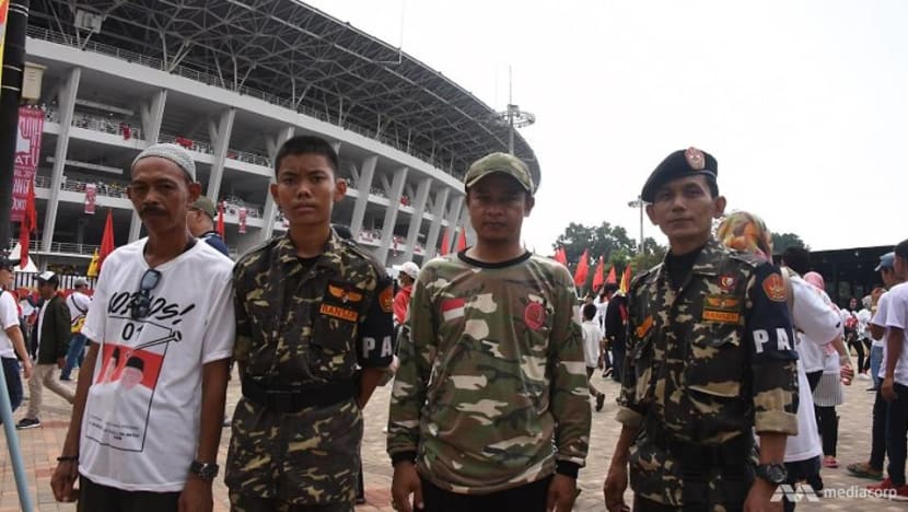 Election enforcers: Paramilitary groups for Jokowi and Prabowo flex their muscles at rallies