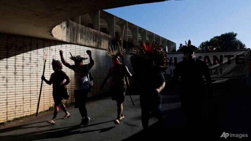 Firing arrows, indigenous people in Brazil protest Bill curtailing land rights Firing arrows, indigenous people in Brazil protest Bill curtailing land rights