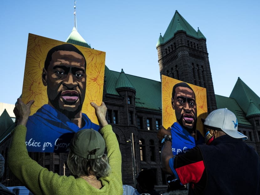 People gather during a demonstration outside the Hennepin County Government Center on March 29, 2021 in Minneapolis, Minnesota. Opening statements were given today in the trial of former Minneapolis police officer Derek Chauvin, who is charged with multiple counts of murder in the death of George Floyd in May 2020. People gather during a demonstration outside the Hennepin County Government Center on March 29, 2021 in Minneapolis, Minnesota. Opening statements were given today in the trial of former Minneapolis police officer Derek Chauvin, who is charged with multiple counts of murder in the death of George Floyd in May 2020.