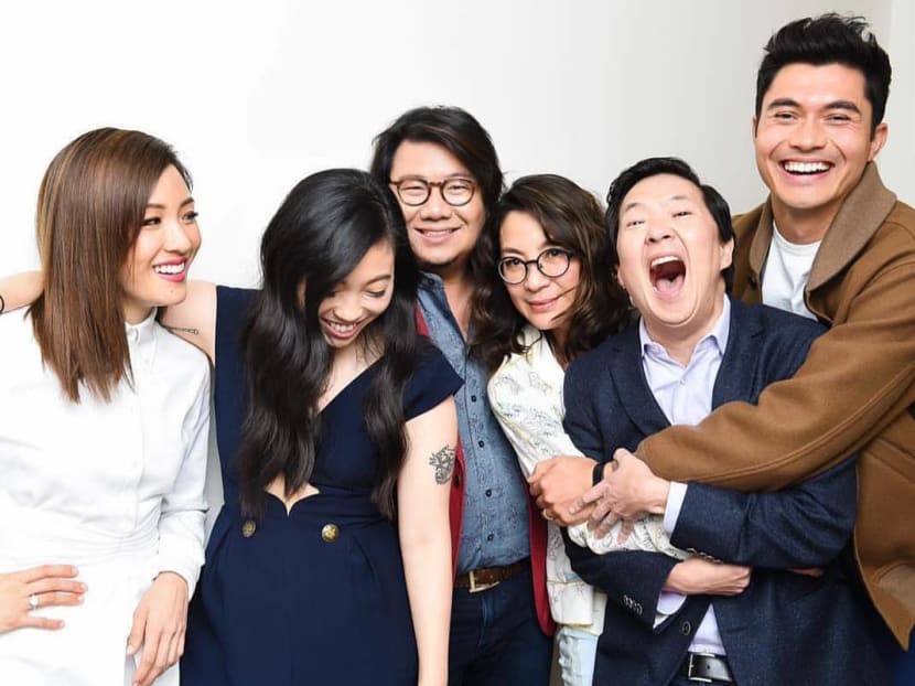 Kevin Kwan (centre) with the cast of Crazy Rich Asians. Mr Kwan is wanted in Singapore for defaulting on his National Service obligations, the Ministry of Defence said on Wednesday in response to media queries.