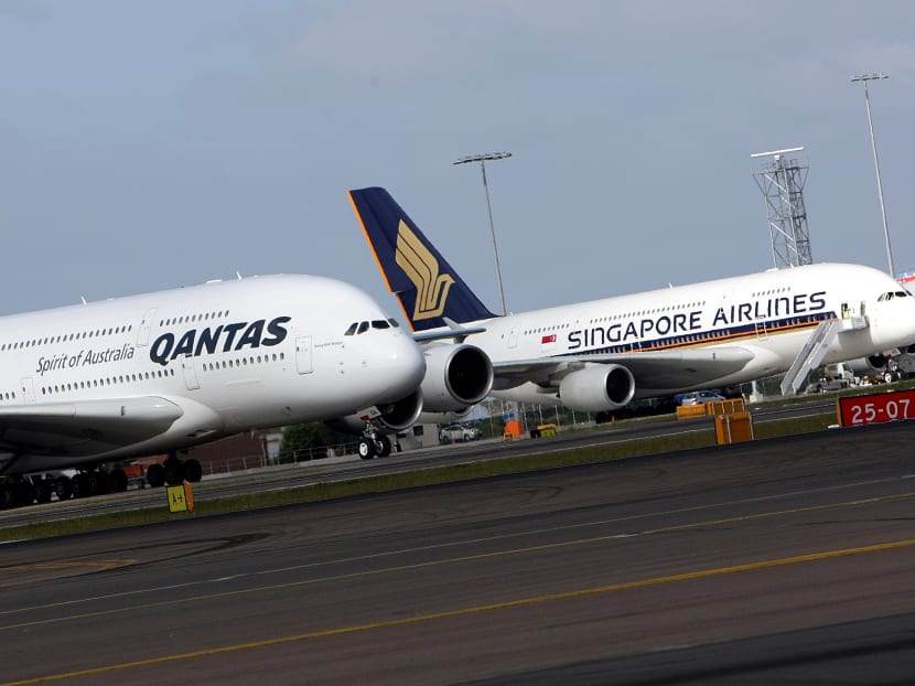 Qantas and Singapore Airlines planes. AFP file photo