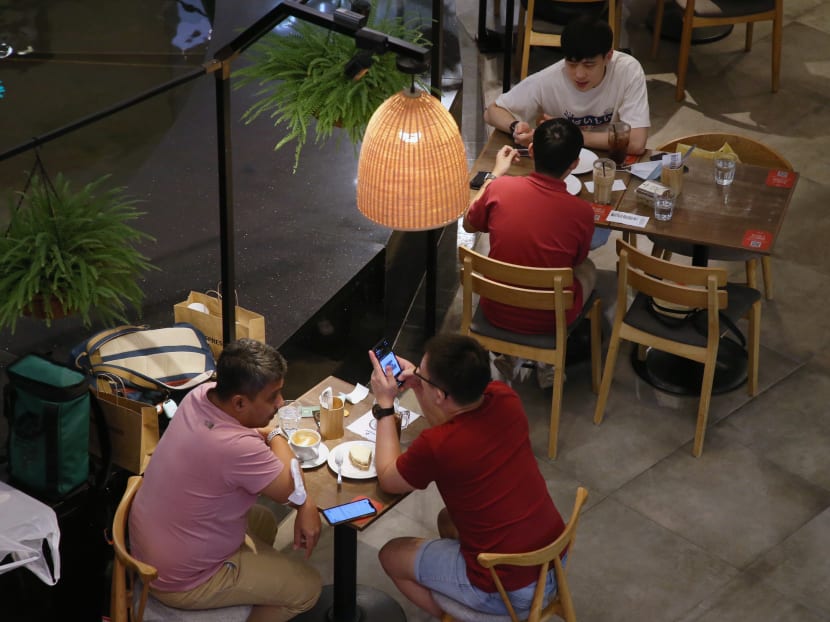 Diners at a restaurant in Raffles City Shopping Centre on July 20, 2021. Diners at a restaurant in Raffles City Shopping Centre on July 20, 2021.