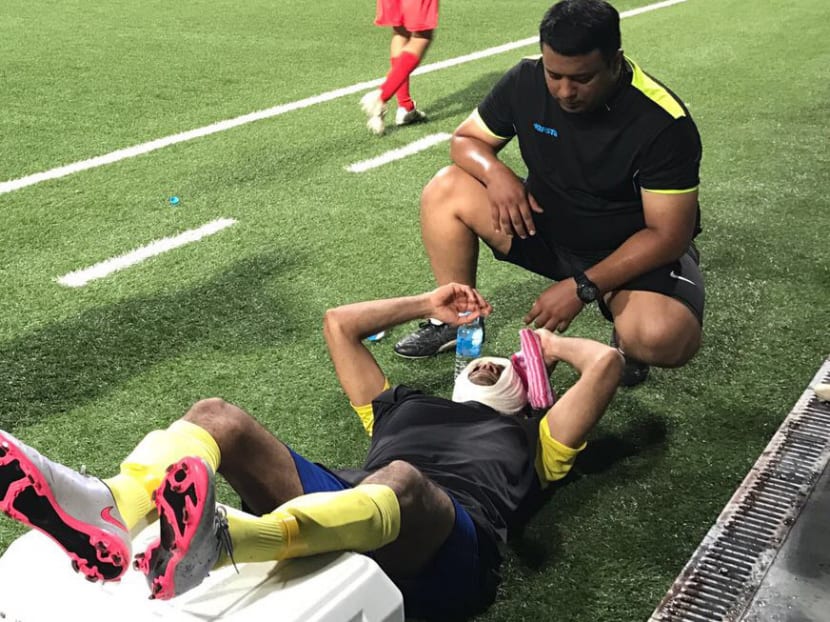 South Avenue player Basit Hamid receiving treatment after a collision with a Gymkhana player. Photo: TheMonitorSG