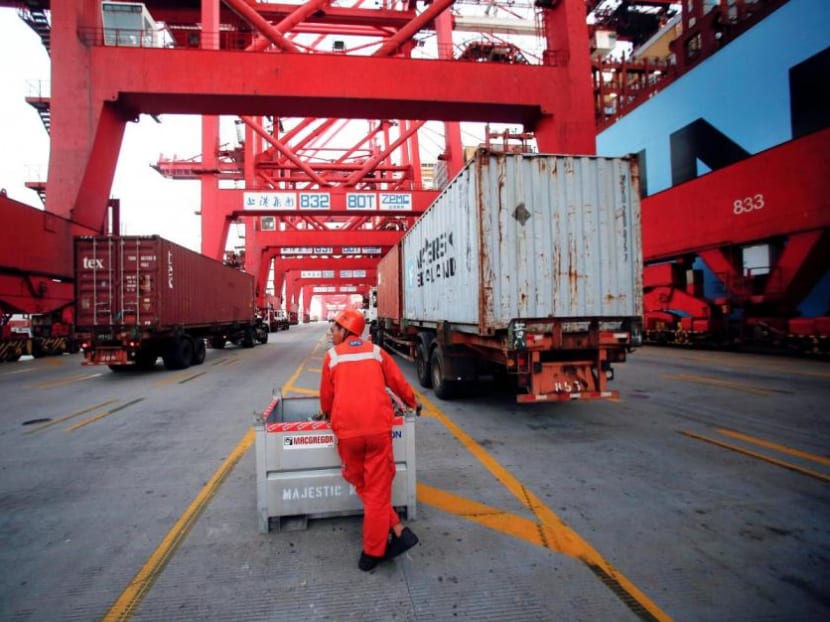 A worker is seen at the Yangshan Deep Water Port, part of the Shanghai Free Trade Zone, in Shanghai, China.