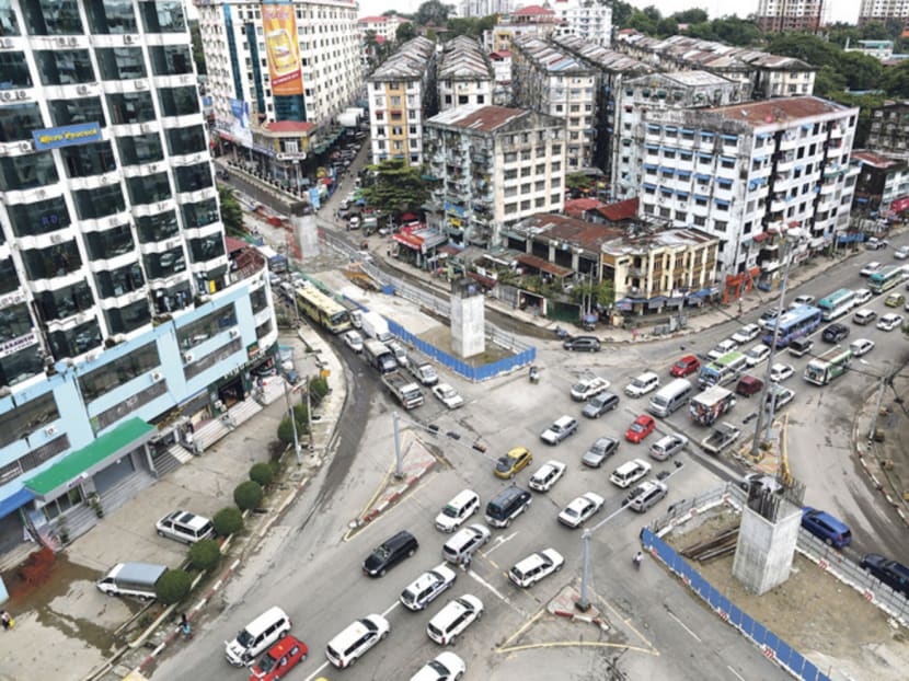 Shwegontai junction is one of the busiest in Yangon. More Singaporean firms, such as Keppel Land, are taking the plunge into this emerging market. Photo: Reuters