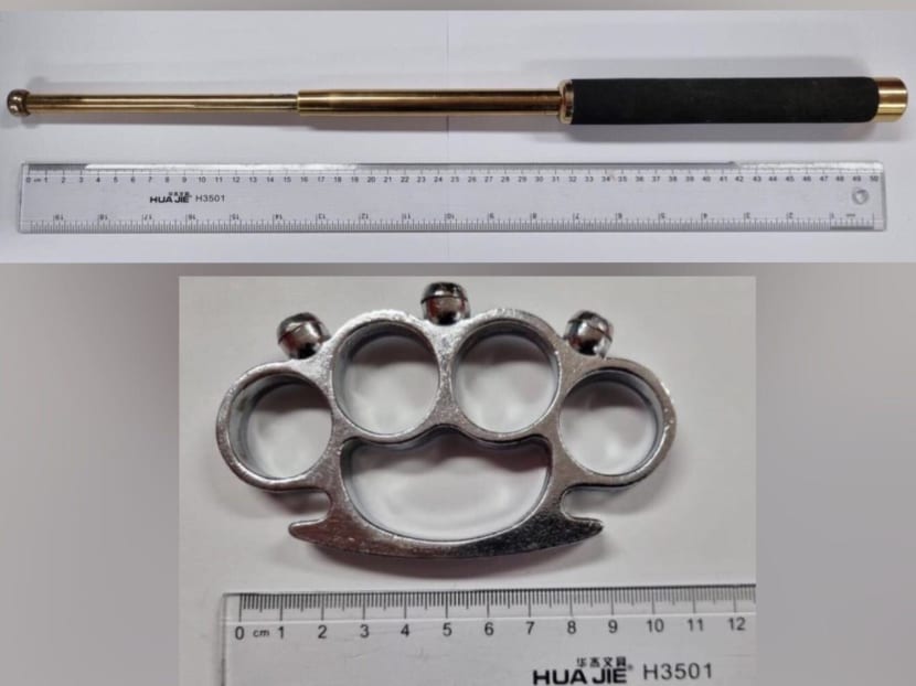A baton (top) and a knuckleduster (bottom) were seized from a 21-year-old suspect on Sept 13, 2022.