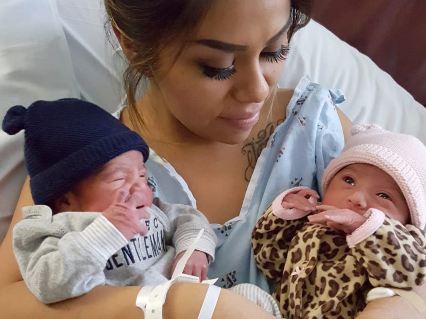 Maribel Valencia holds her newborn twins at the San Diego Kaiser Permanente Zion Medical Center in San Diego. Jaelyn, right, and Luis Salgado, who were born just minutes apart, but in different years. Photo: Kaiser Permanente San Diego via AP