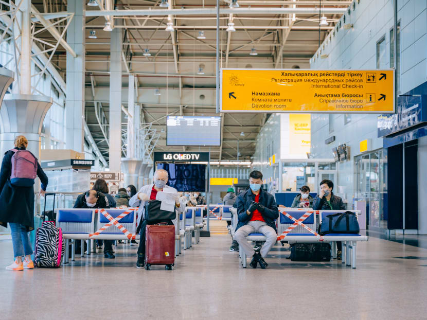 Passengers of a flight to Nur-Sultan wait before boarding a plane at Almaty International Airport, Kazakhstan on May 1, 2020. Passengers of a flight to Nur-Sultan wait before boarding a plane at Almaty International Airport, Kazakhstan on May 1, 2020.