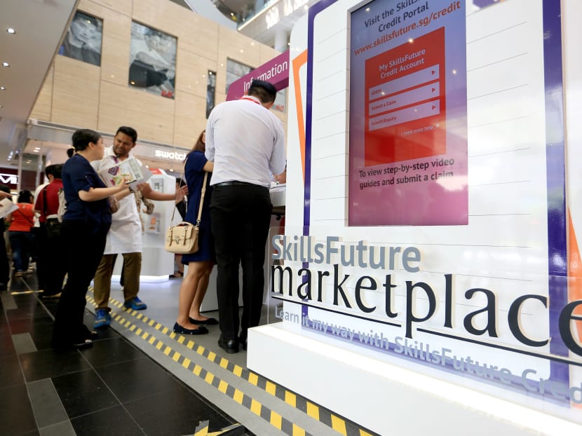 Members of public visiting and asking questions of the SkillsFuture Credit and courses at a SkillsFuture Marketplace roadshow. TODAY file photo