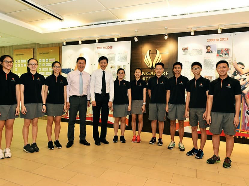 SSP principal Tan Teck Hock (left) and Ngee Ann Polytechnic principal Clarence Ti with student-athletes of the Diploma in Business Studies programme. The three-year course is open to both SSP student-athletes and those from mainstream schools. Photo: Singapore Sports School