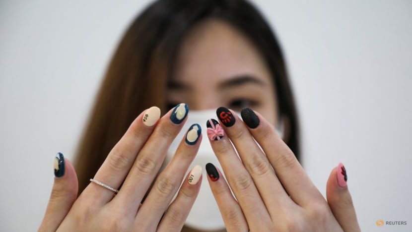 Malaysian salon paints Squid Game manicures of tiny coffins, green tracksuits Malaysian salon paints Squid Game manicures of tiny coffins, green tracksuits