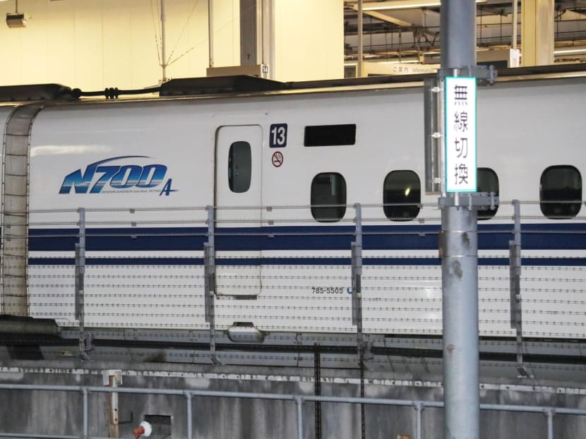 A bullet train is seen at JR Nagoya Station Tuesday after its operation was suspended Monday due to a burning smell, a frame crack and an oil leak were found underneath it. Photo: Kyodo