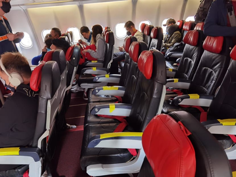 A photo posted on Mr Edward Yong's Facebook showing the yellow tapes pasted on the seats' armrests.