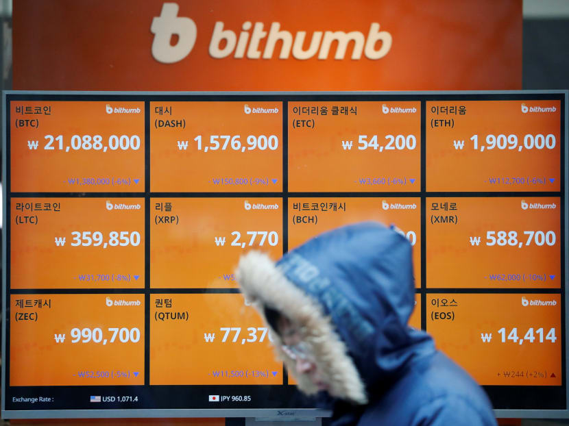 A man walks past an electric board showing exchange rates of various cryptocurrencies at Bithumb cryptocurrencies exchange in Seoul. Seoul’s tough stance triggered a selloff of the cyrptocurrency on both local and offshore exchanges. Photo: Reuters