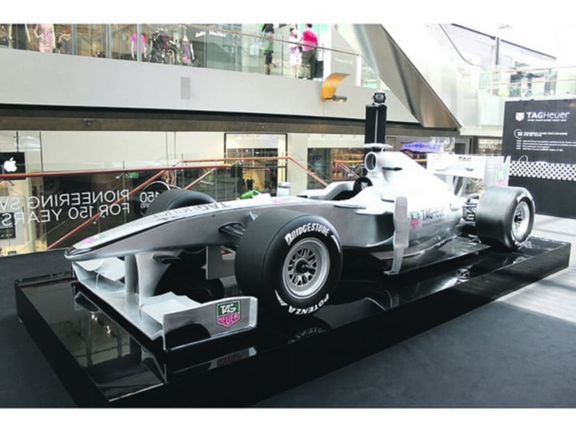 Visitors can challenge the race lap time set by the 2016 Formula One champion Lewis Hamiliton through a F1 racing simulator located outside the IWC boutique. Photo: f1racingsimulator Official Website