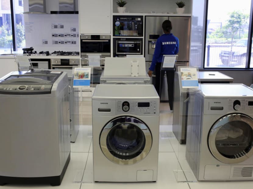US President Donald Trump’s attack on washing machine imports may end up putting the Singapore dollar through the spin-cycle. Photo: Reuters
