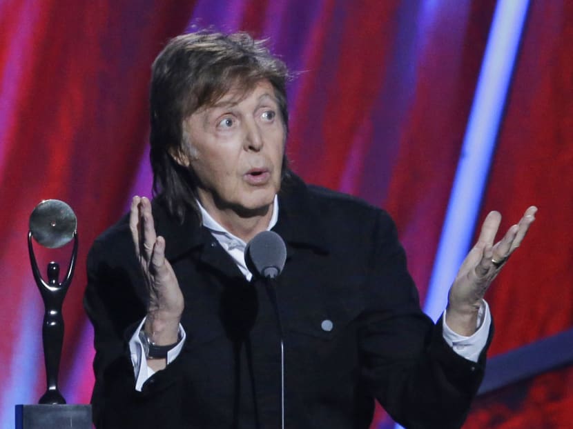 Paul McCartney introduces Ringo Starr at the Rock and Roll Hall of Fame induction ceremonies,  in Cleveland, USA. Photo: AP