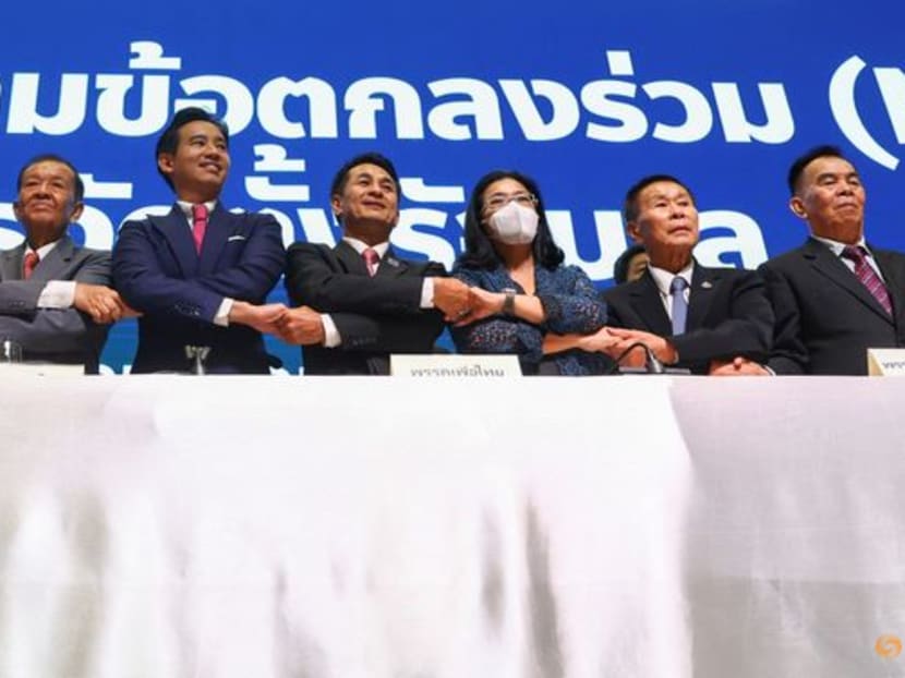 Move Forward Party leader Pita Limjaroenrat, holds hands with coalition party leaders during a press conference to announce the party's agreement with coalition partners in Bangkok, Thailand, on May 22, 2023.