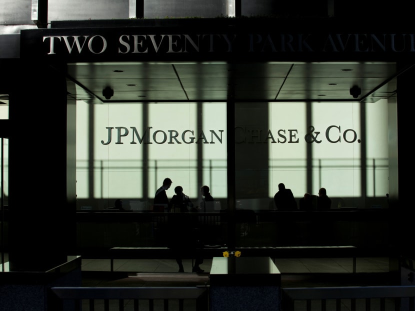 People walk inside the JP Morgan headquarters in New York.