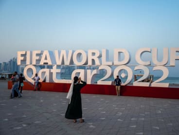 Visitors take photos with a Fifa World Cup sign in Doha on Oct 23, 2022, ahead of the Qatar 2022 Fifa World Cup football tournament.