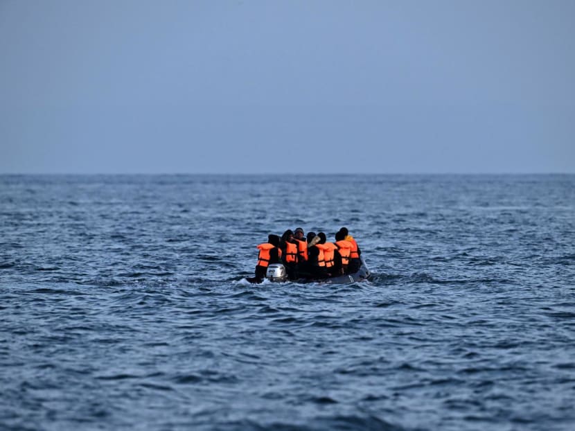 Migrants travel in an inflatable boat across the English Channel, bound for Dover on the south coast of England. More than 45,000 migrants arrived in the UK last year by crossing the English Channel on small boats.