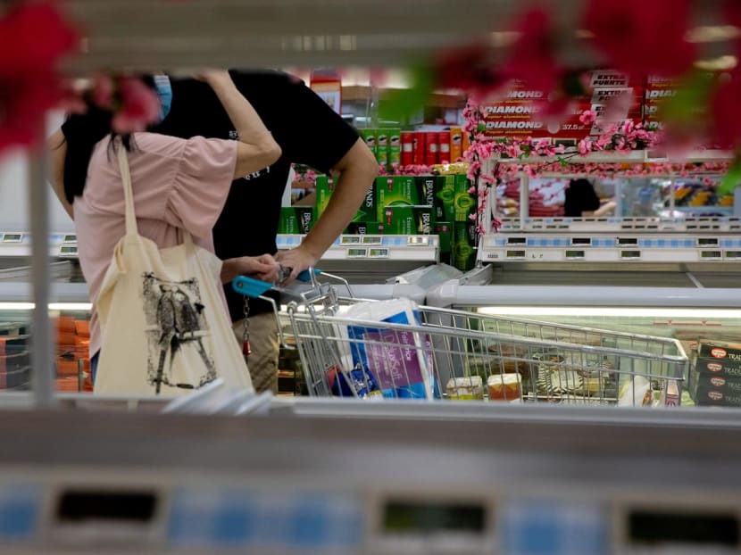 People shopping at a supermarket. People shopping at a supermarket.